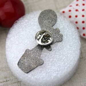 The Back of The Wooden Child Lapel Pin