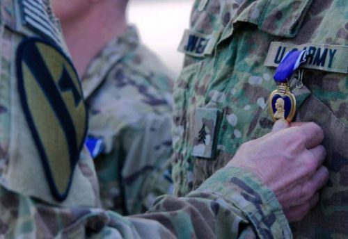 wearing purple medals